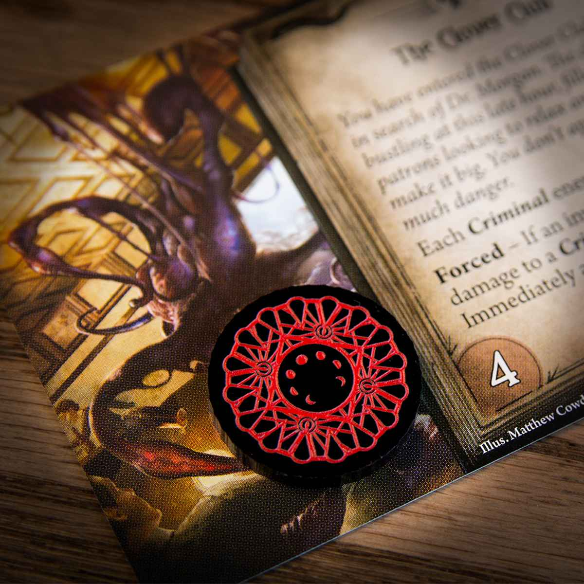 A one-value Doom Token on top of an Arkham Horror LCG Agenda Card