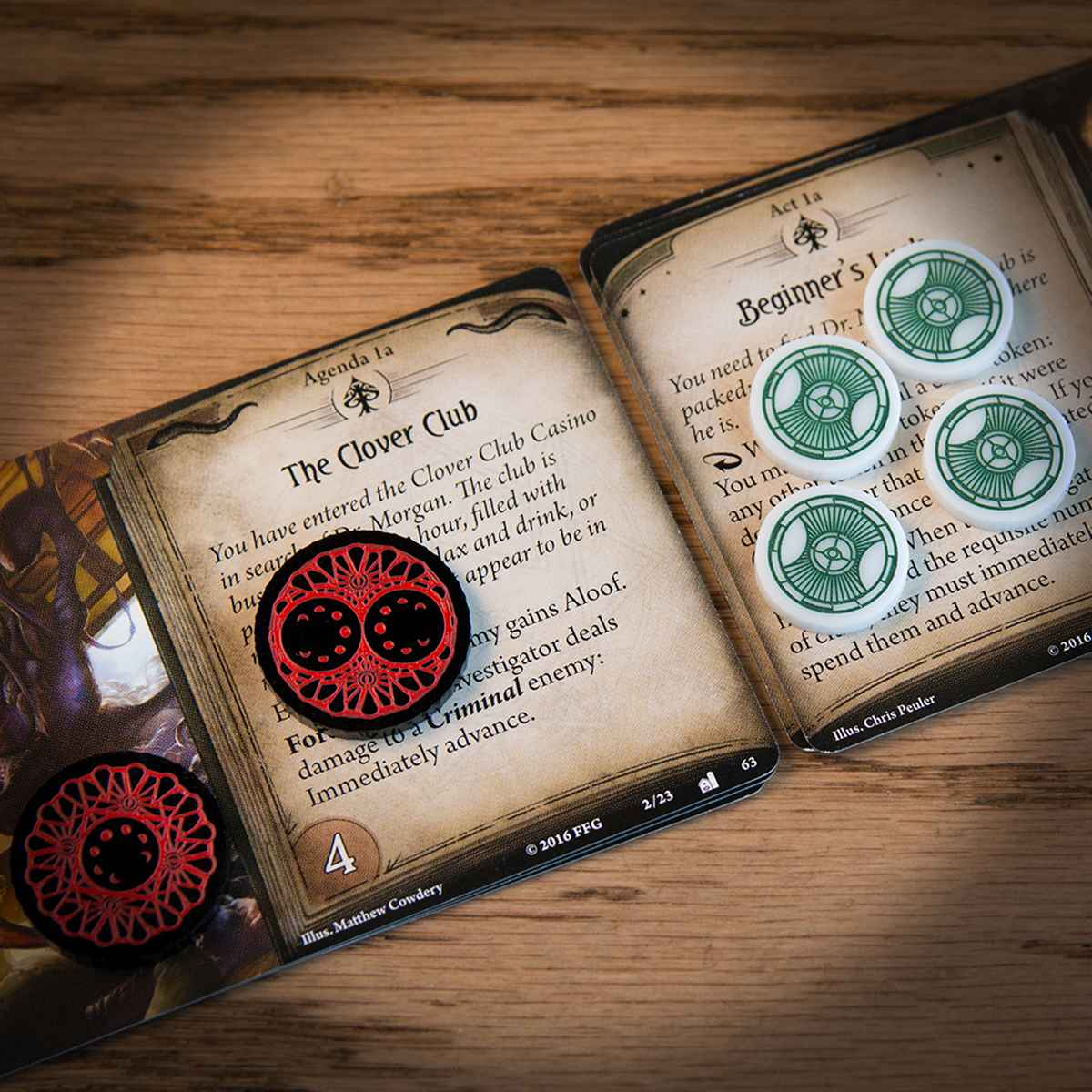 A one-value Doom and two-value Doom as well as four Clue Tokens on top of Arkham Horror LCG Act and Agenda cards