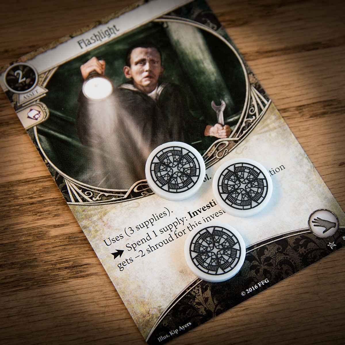 Supply tokens on top of the Arkham Horror LCG card "Flashlight" 