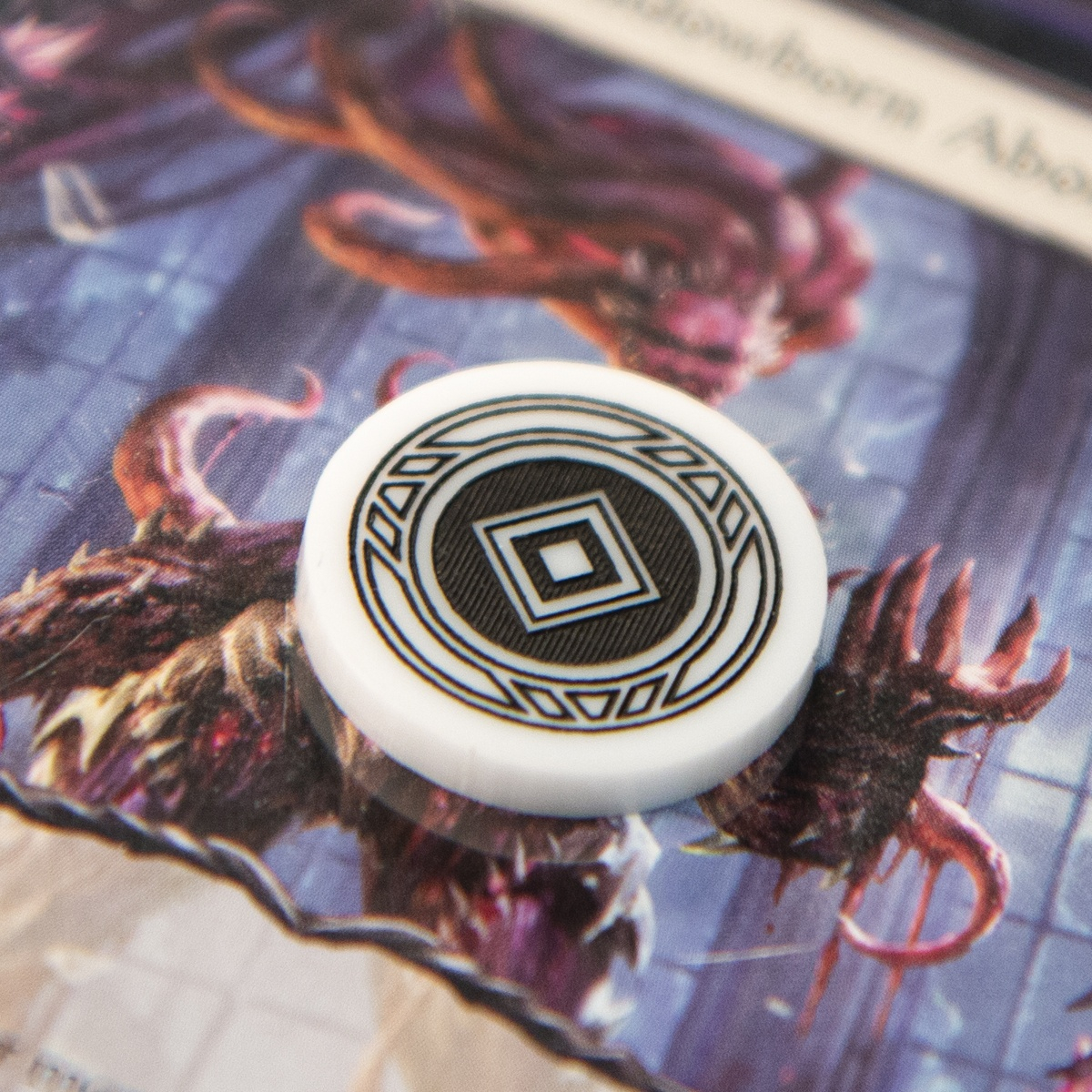 Extreme close up of the Activation Token from the Majestic Token Set showing the details of the engraving