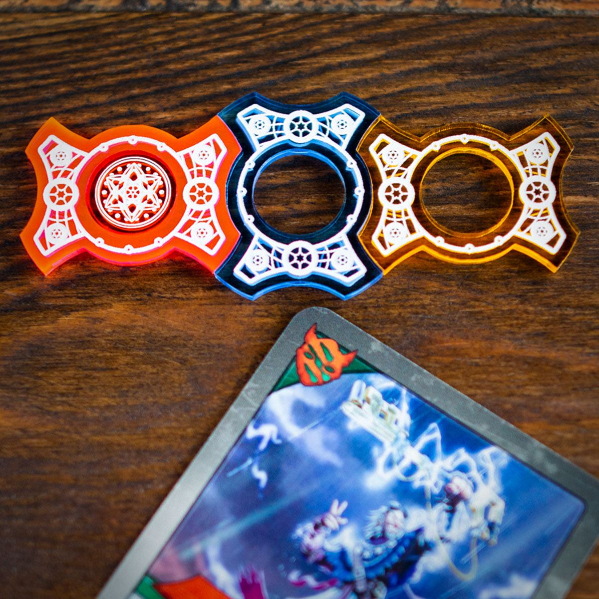 Close up of the Red, Blue, and Yellow Primary Set Keys with only the Red Key containing an Amber token in its center