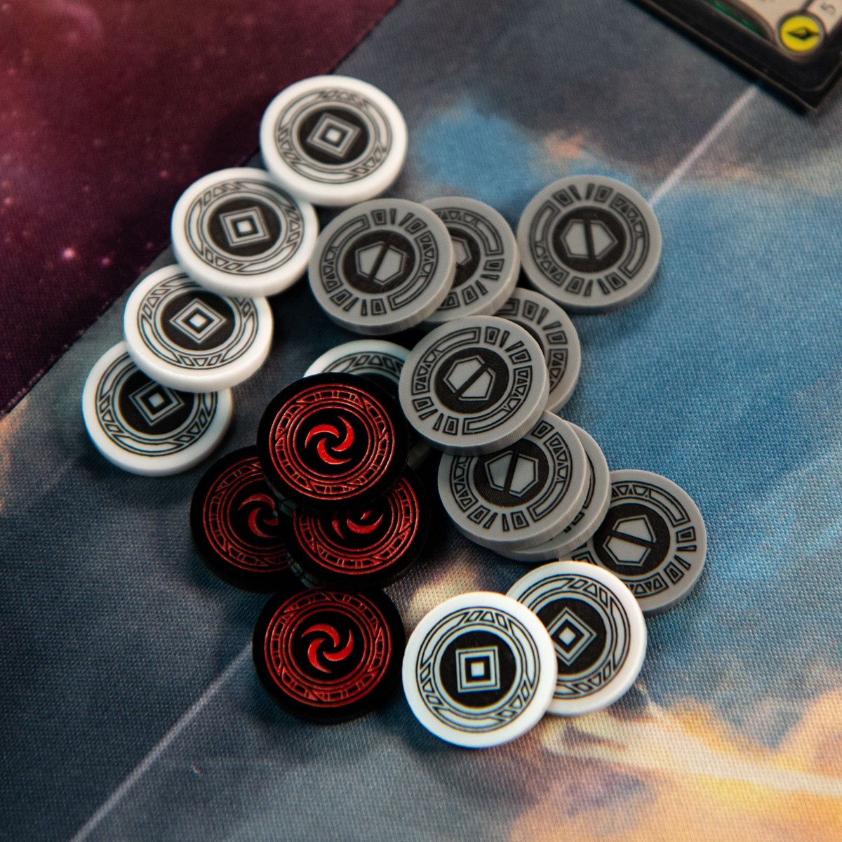 Eight Armor Tokens, seven Activation Tokens, and four Resource tokens casually jumbled together.