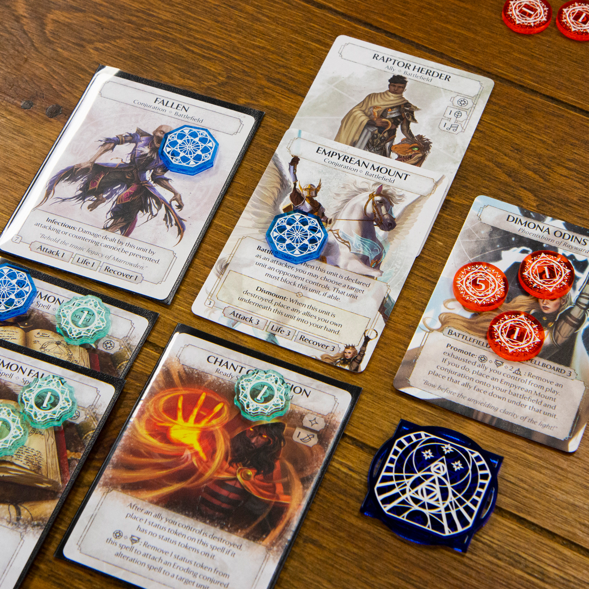 Exhaustion, Damage, Status, and First Player tokens from the Arcane Token Set as they might look during a game of Ashes: Reborn