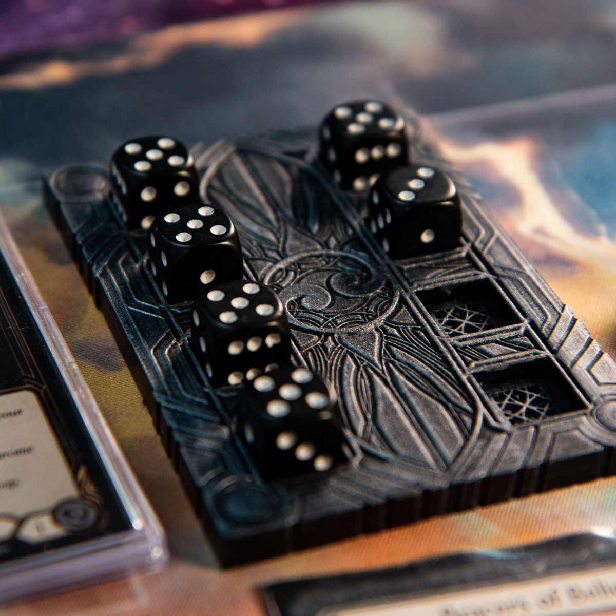 Low angle shot of Majestic Dice Board - Battleworn Edition with two dice removed and next to a few Flesh and Blood TCG cards