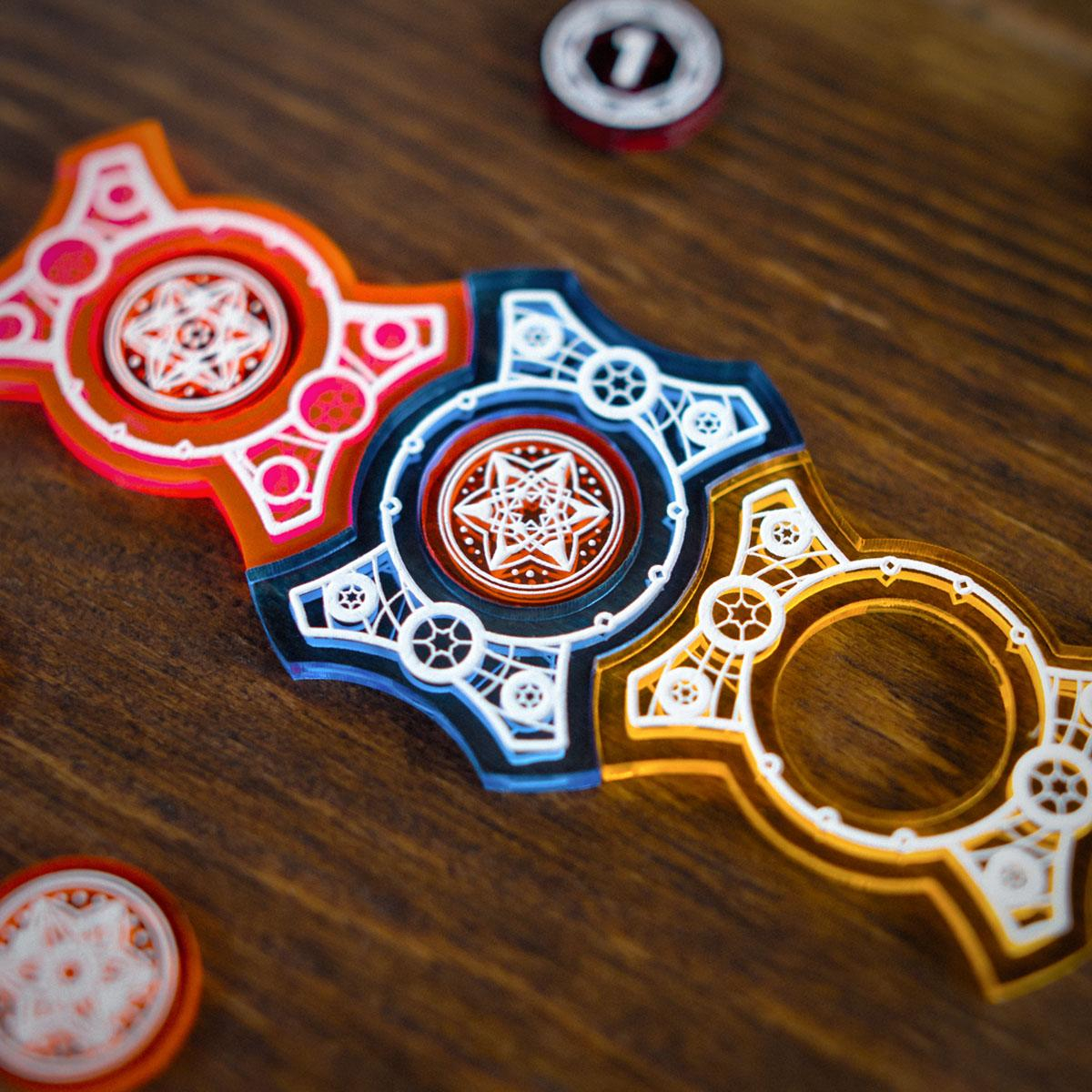 Close up of the Red, Blue, and Yellow Primary Set Keys with the Red Key and Blue Key containing Amber tokens in their centers