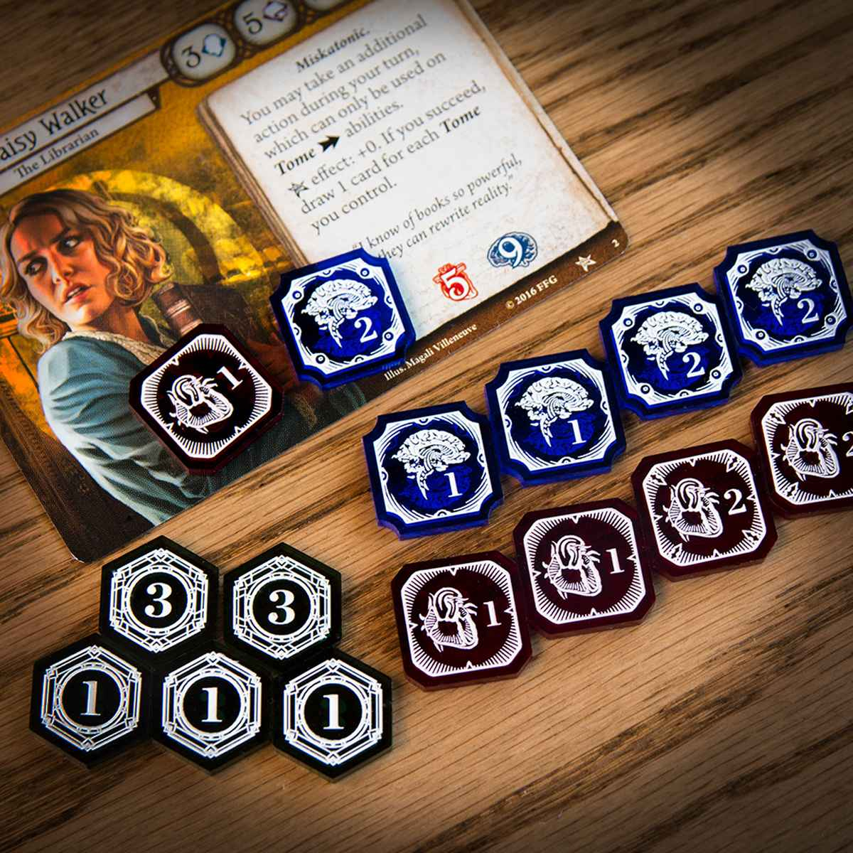 Full Investigator Mythos Token Set including one-value and three-value Resource Tokens, as well as one-value and two-value Sanity and Damage Tokens displayed on a wooden table.  One one-value Damage and one two-value Sanity Token are on the Arkham Horror LCG card, Daisy Walker