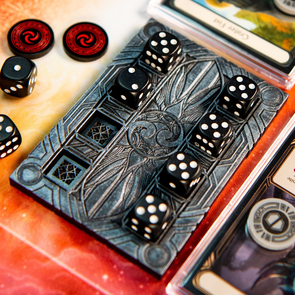 Majestic Dice Board - Battleworn Edition brightly lit and with to dice removed from the bottom left various cards from Flesh and Blood TCG surround the dice board, as do tokens from the Majestic Token Set