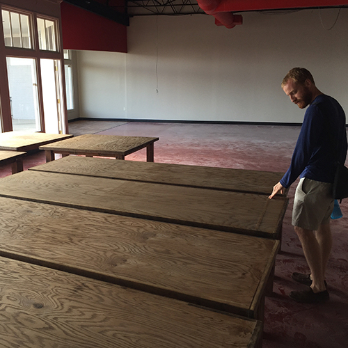 Steven examining tables in the 2.0 store under construction.